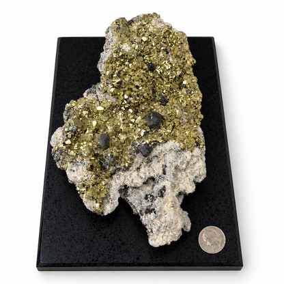 Peruvian pyrite and galena specimen on black display base viewed lengthwise, quarter for size reference