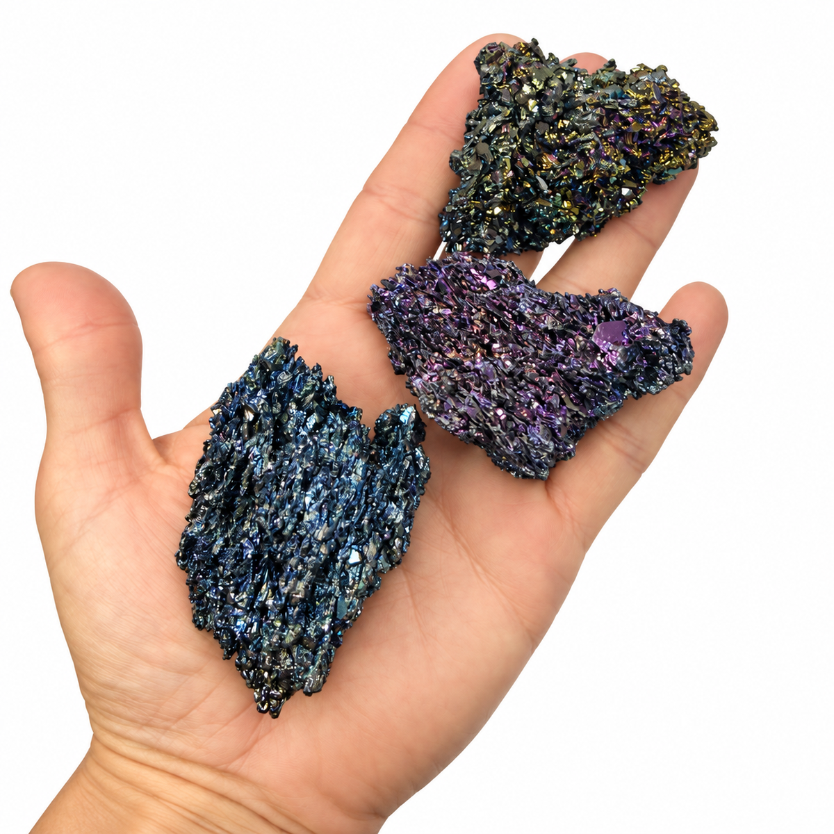 Raw rainbow Carborundum specimen with gold, blue, and purple crystal faces held in hand