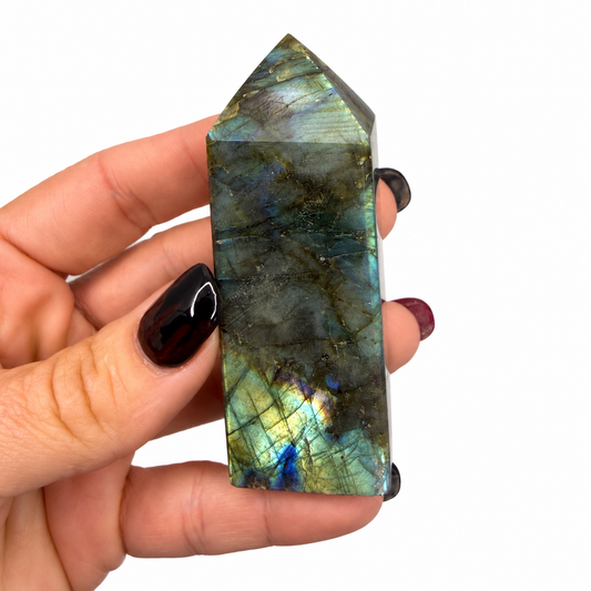 High flash labradorite tower with blue-green labradorescence, shown next to a quarter for scale - Magick Souls