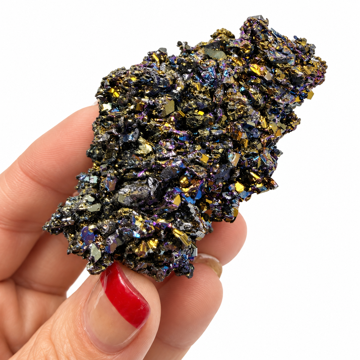 Three raw Carborundum silicon carbide specimens in blue, purple, and gold shown in palm for size