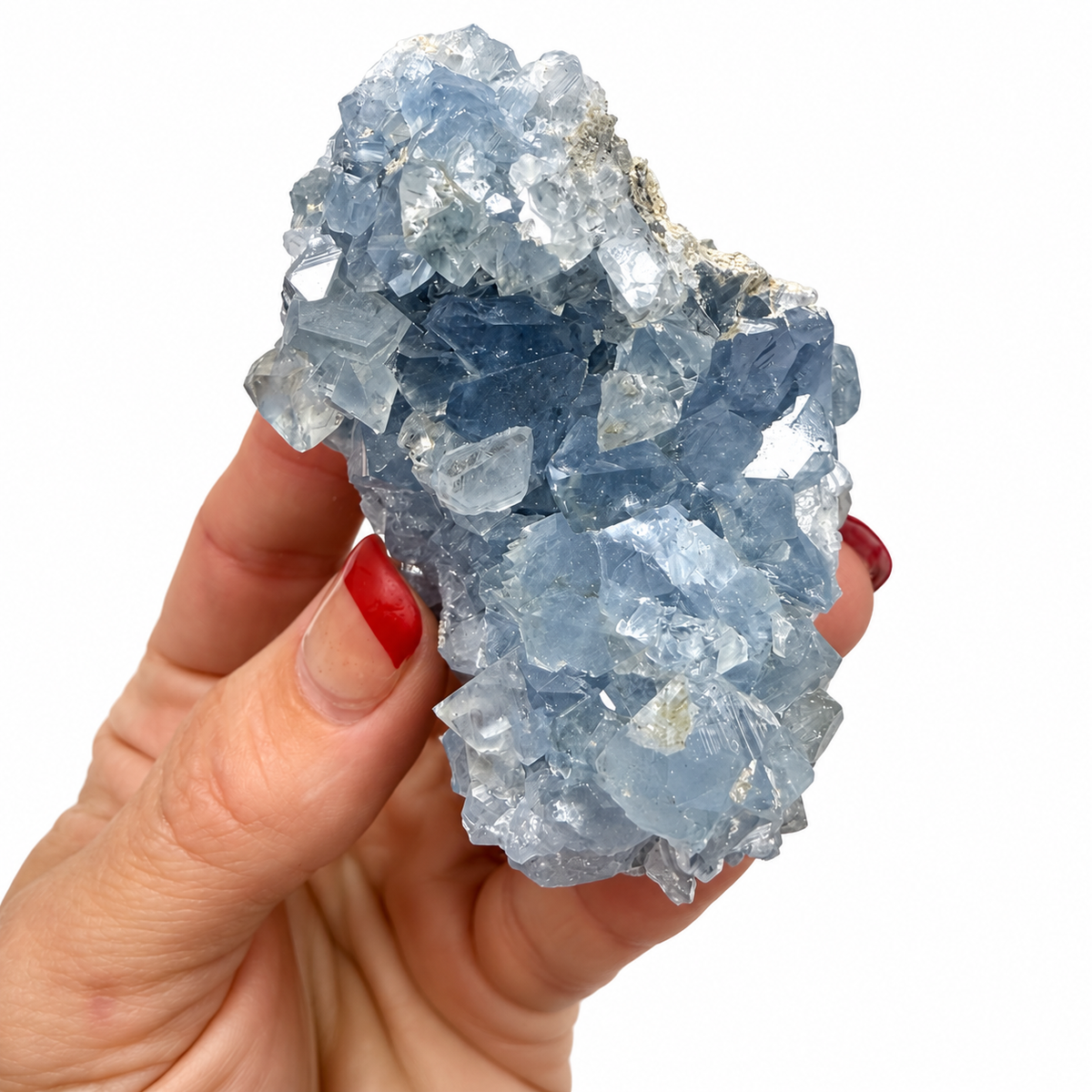 Blue Celestite cluster shown with a quarter for size reference