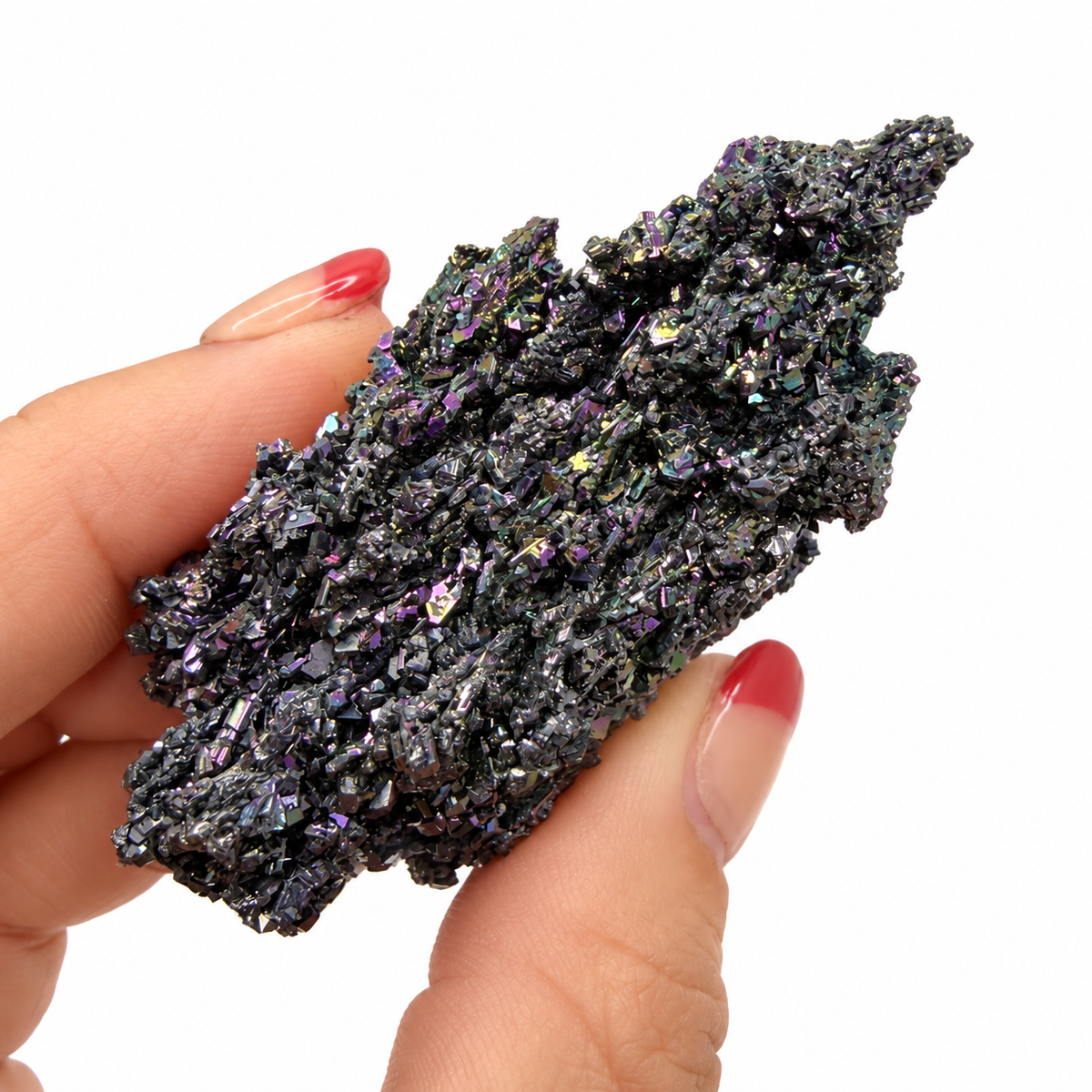 Raw Carborundum crystal specimen with purple and green iridescent sparkle held in fingers