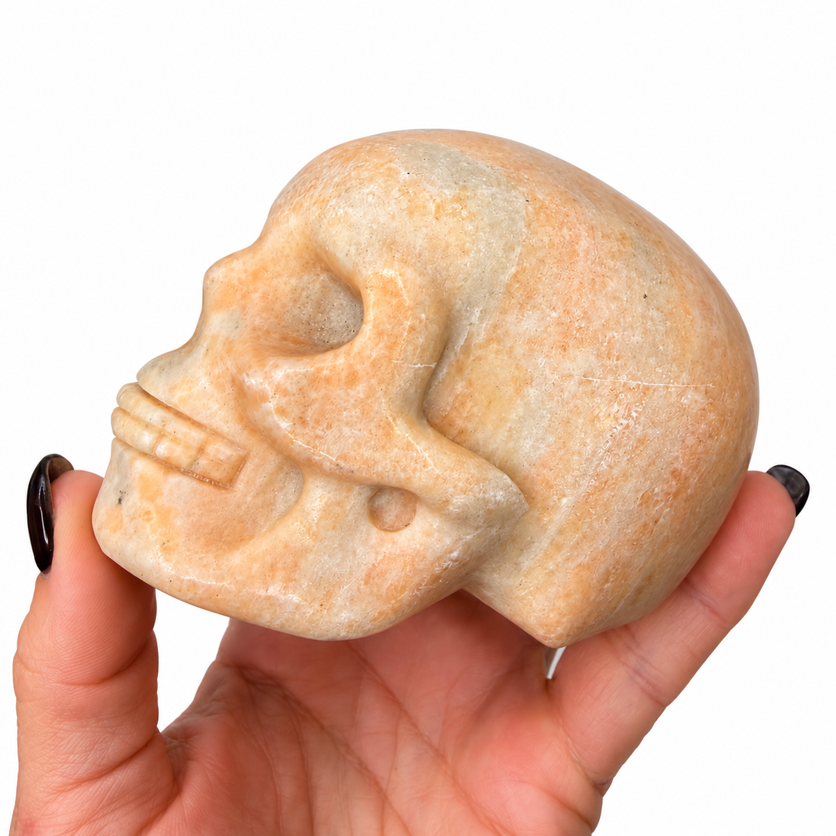 Peach calcite stone skull carving, natural color variation - Magick Souls