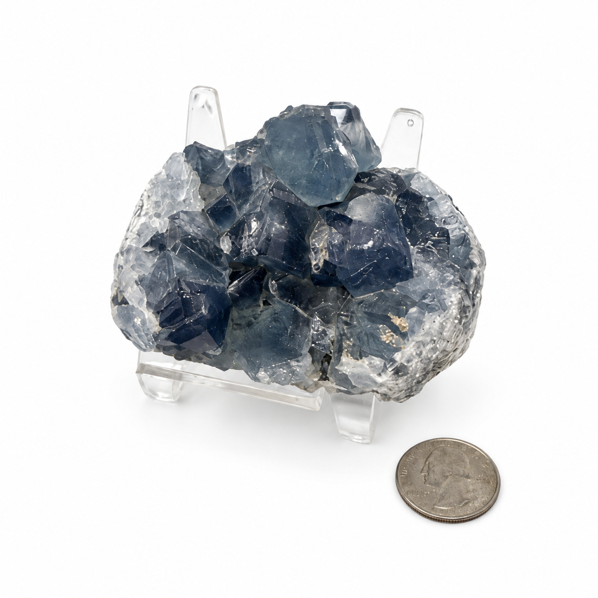Celestite cluster with a quarter for size comparison