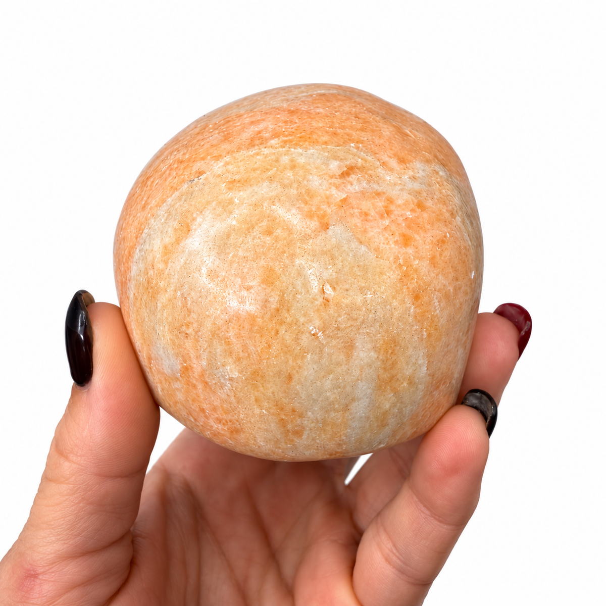 Peach calcite crystal skull side view with creamy white and peach coloring - Magick Souls