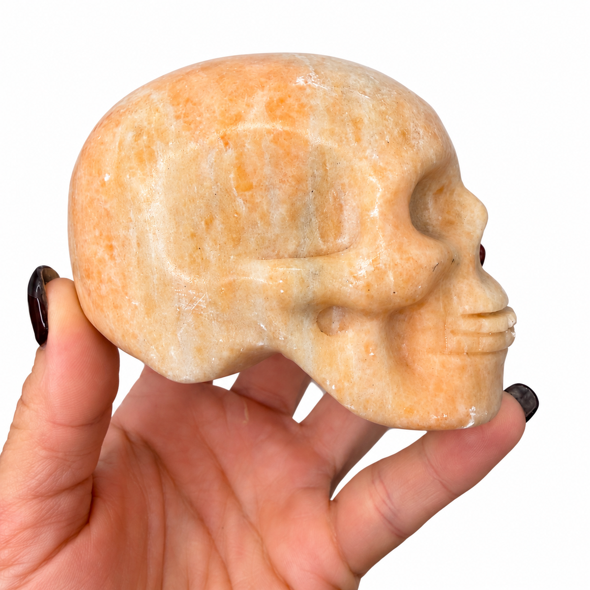 Large peach calcite crystal skull carving for altar or display - Magick Souls