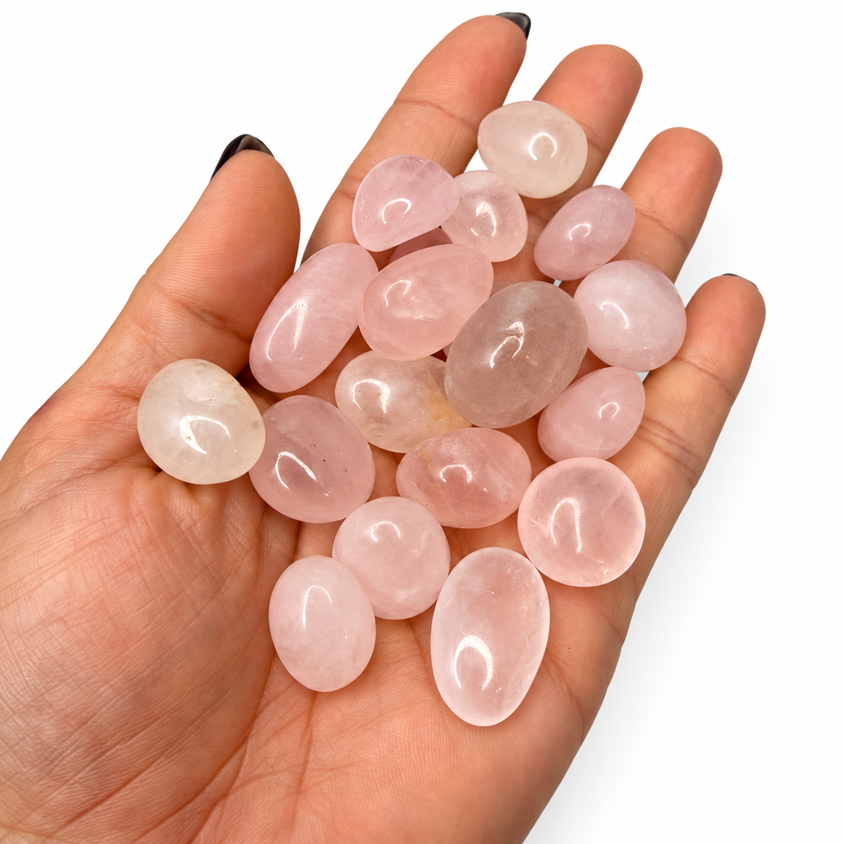 Rose quartz tumbled crystal stones close-up, soft blush to rosy peach - Magick Souls