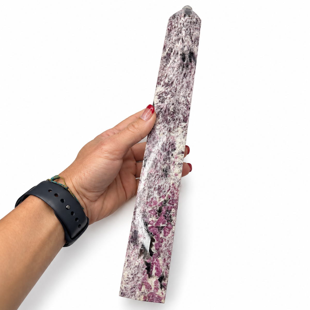 Unicorn Stone tower showing pink, purple, white, and black mineral pattern