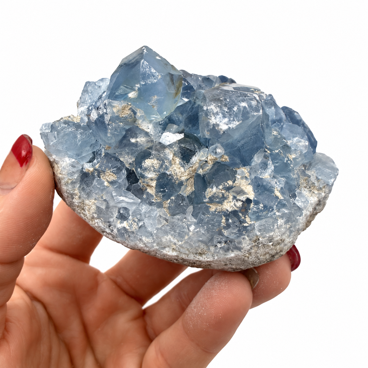 Celestite crystal cluster shown with a quarter for size reference