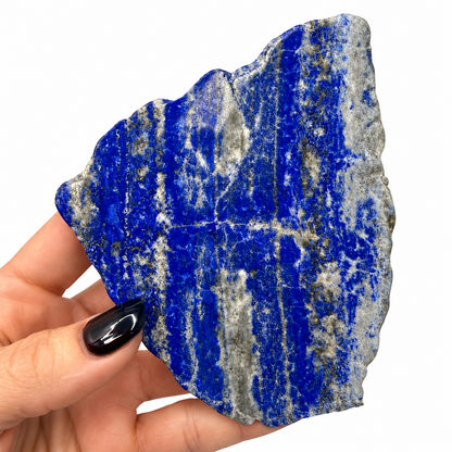 Deep blue lapis lazuli slab showing horizontal white calcite and golden pyrite bands - Magick Souls