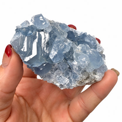 Natural blue Celestite crystal cluster with twinkling points
