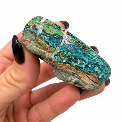 Polished shattuckite showing blue, teal and copper-brown veins - Magick Souls