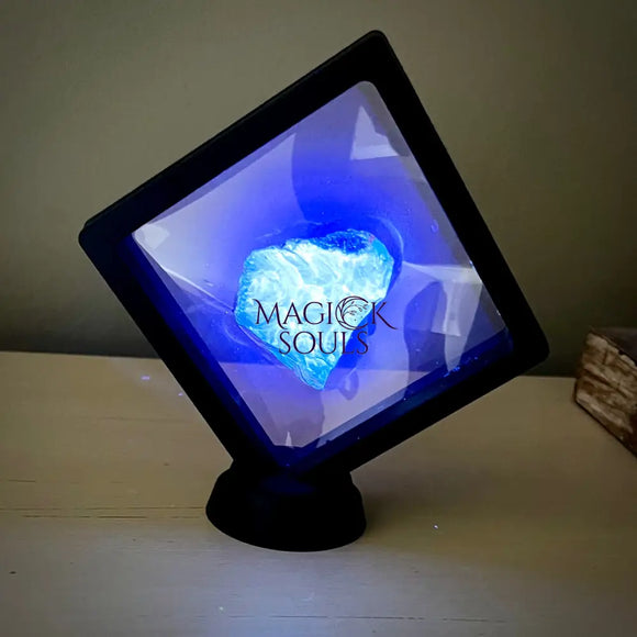 Blue UV Reactive Sumatran Amber in display - Magick Souls