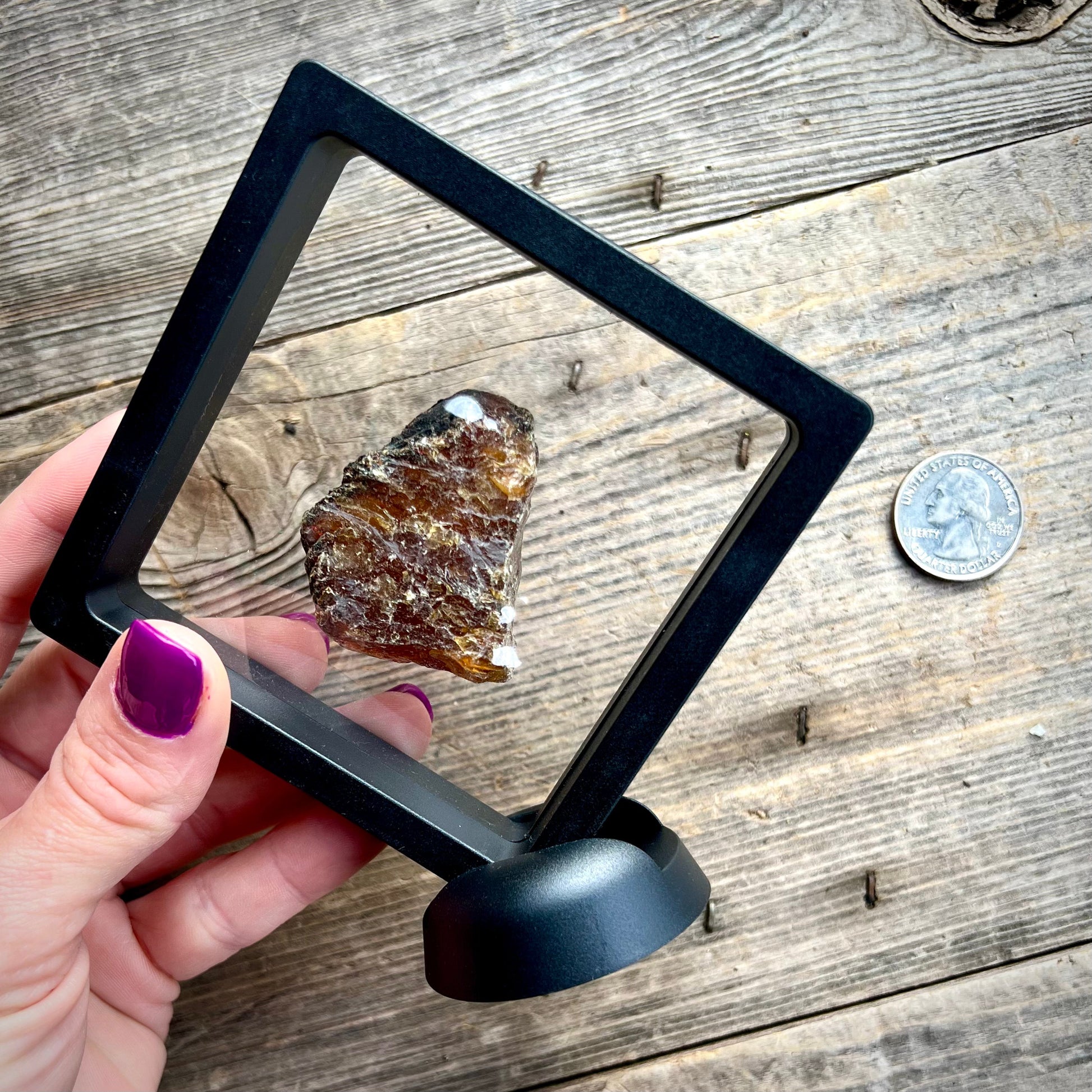 Blue UV Reactive Sumatran Amber in display - Magick Souls