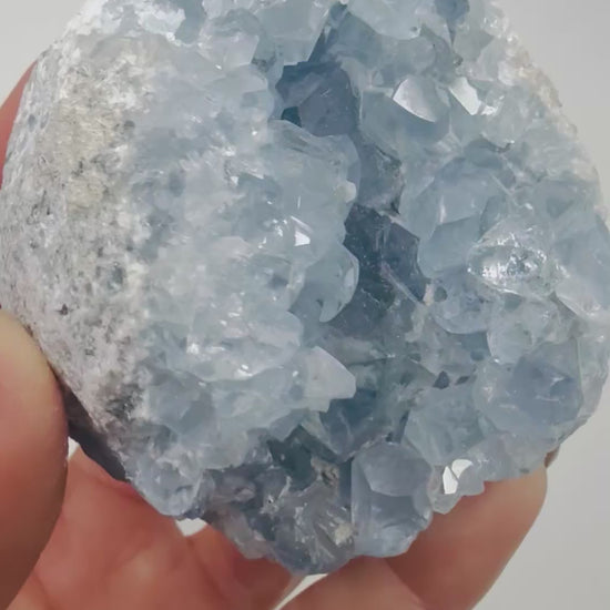 Video of a blue Celestite crystal cluster sparkling in the light