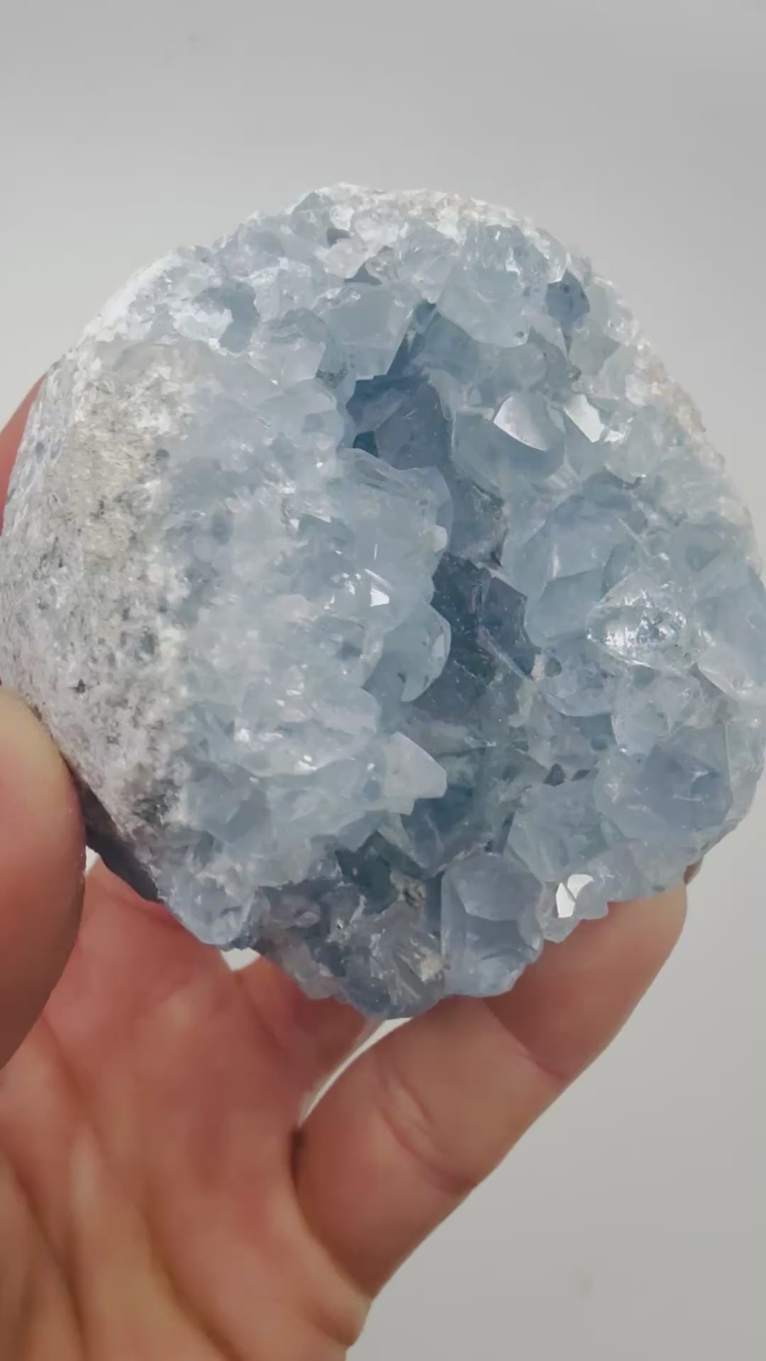 Video of a blue Celestite crystal cluster sparkling in the light