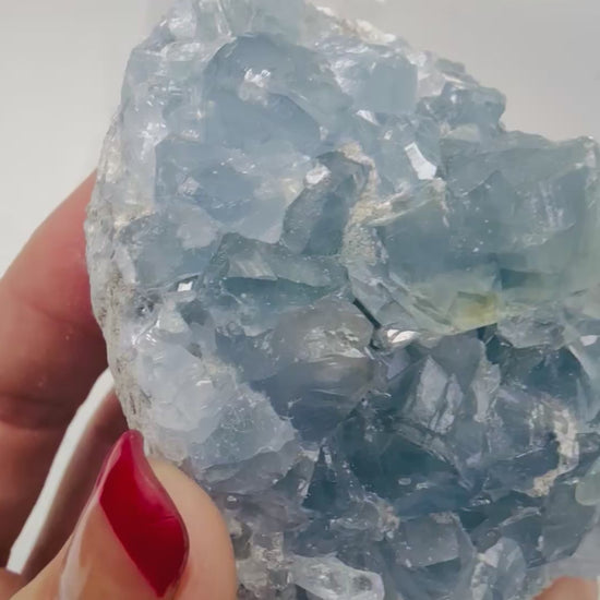 Video of natural blue Celestite crystal cluster sparkling in the light