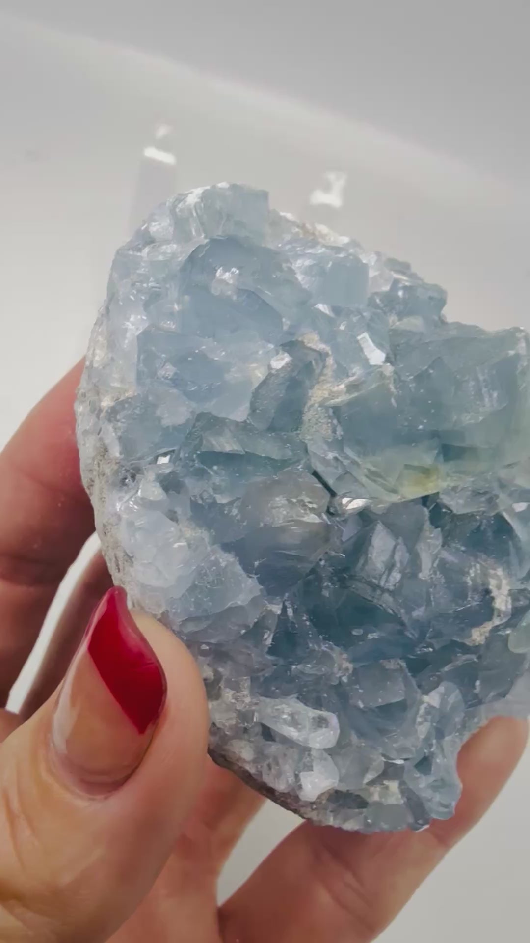 Video of natural blue Celestite crystal cluster sparkling in the light