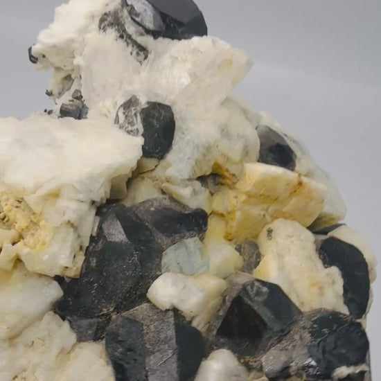 Black tourmaline and aquamarine on feldspar specimen video - Magick Souls