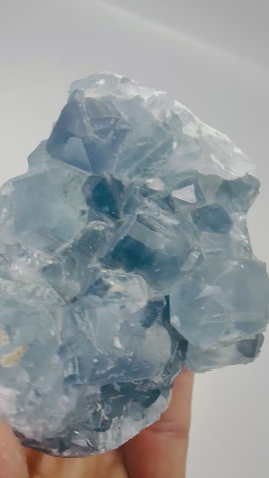 Video of a blue Celestite crystal cluster shimmering in the light