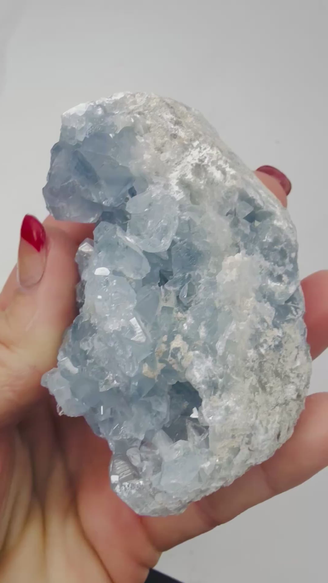 Video of a natural Celestite crystal cluster sparkling